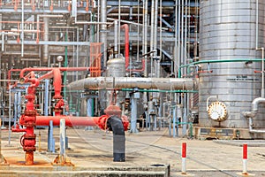 The equipment of oil refining, Detail of oil pipeline with valves in large oil refinery, Industrial zone.