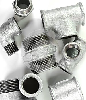 Metal elbow fittings for pipes, isolated white background.Tools and materials for sanitary works.