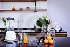 Equipment and raw materials for making smoothie orange juice in the kitchen