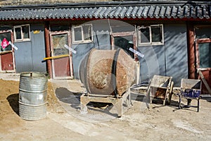 equipment for a small construction site. old concrete mixer