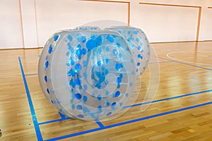 Equipment for team building sport game named bumper ball or bubble ball. Zorbsoccer. Blue bumper boll bubble balloons in