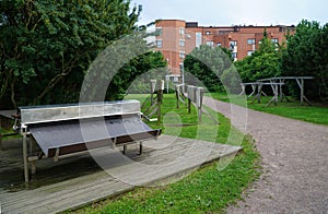 Equipment for washing, wringing and drying carpets in a residential area on the seafront in Helsinki.