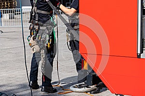 Equipment for work at height on the belt of a worker.