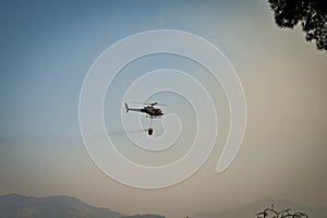 Equipped helicopter fighting forest fires