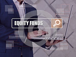 EQUITY FUNDS text in search line. Budget analyst looking for something at computer