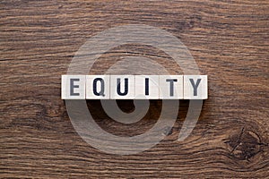 Equity - word concept on building blocks, text