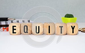 Equity , word written on wooden cubes and white background