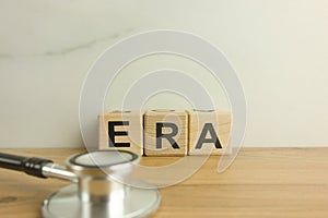 ERA estrogen receptor assay acronym from wooden blocks with stethoscope