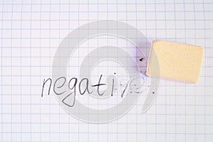 Eraser erasing on the sheet in the cage word: negative.