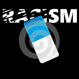 Eraser erasing the word RACISM