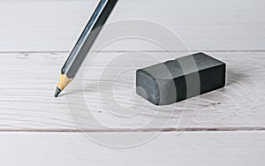 Eraser and error concept, Eraser and pencil on white table