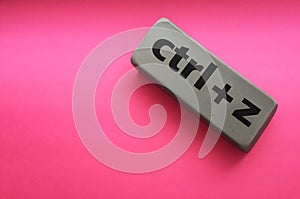 eraser with the inscription & x22;ctrl + z& x22; on a pink background photo