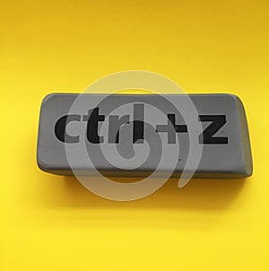 eraser with the inscription & x22;ctrl + z& x22; on a yellow background photo