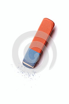 Eraser or rubber with rubber residue on white photo