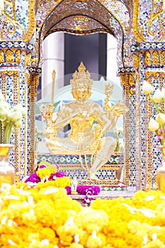 The Erawan Shrine. Or formally known as the Thao Maha Phrom Shrine, one of tourist attractions in Bangkok, Thailand photo