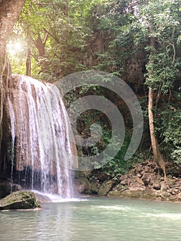 Erawan Waterfall in Kanchanaburi, Thailand. Landscape of Waterfall Crashing Big Stone on The Clear Natural Water in The Jungle