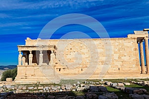 Erechtheion (Erechtheum) or Temple of Athena Polias is ancient Greek Ionic temple on north side of Acropolis in Athens