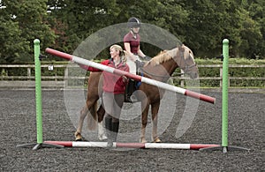 Erecting a riding school jump