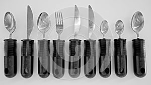 Ergonomic cutlery for the elderly, with arthritis, Parkinson's, apoplexy and the disabled - 3D Rendering photo