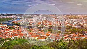 erial view of old Red Tiles roofs in the city Prague, Czech Republic, Europe. Beautiful day with blue sky with clouds in the town.