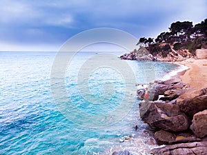 ÃÂerial view. Rocks on the coast of Lloret de Mar in a beautiful summer day,sandy beach, Costa Brava, Catalonia, Spain. photo