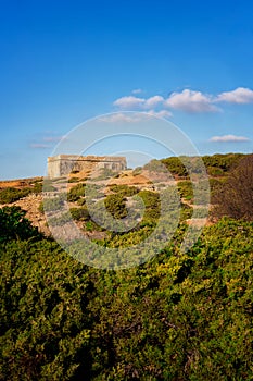 Ericeira Milreu Fort on arid landscape on a sunny day, in Portugal