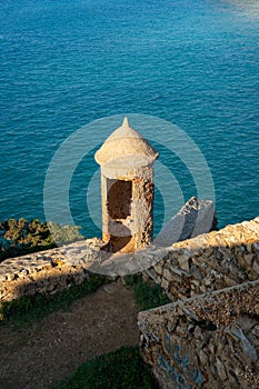 Ericeira Milreu Fort castle towers with turquoise water, in Portugal