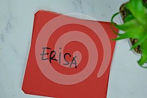 ERISA write on sticky notes isolated on Wooden Table