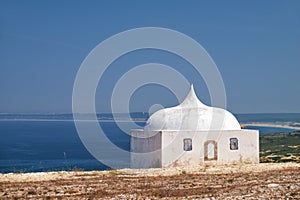 Ermida da Memoria or Memory Chapel of Nossa Senhora do Cabo Church near cape Espichel, Portugal photo