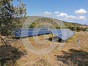 Ermioni greece solar panel photovoltaic electricity array in olive grove