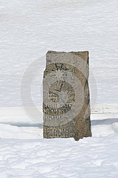 Ernest Shackleton\'s funerary stele under snow, Grytviken cemetery, South Georgia, Antarctica
