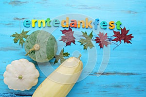 Erntedankfest harvest festival in Germany. Pumpkin, squash, wooden blue background