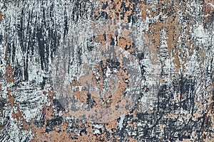 Eroded metal texture with black paint splashes, abstract grunge background