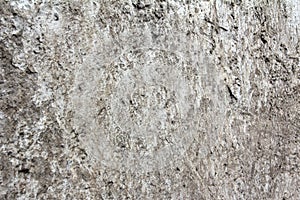 Eroded old grey concrete at a wall for dirty texture, background