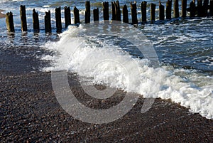 Eroded poles in the sea