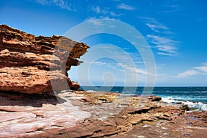 Eroded sandstone cliffs and rock pools