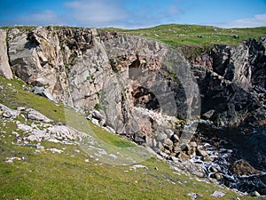 Eroded sea cliffs on the west coast of Kettla Ness off the west coast of Mainland, Shetland.