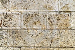 Eroded stone wall as background in Athens, Greece