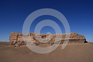 Eroded Stone Wall in Desert