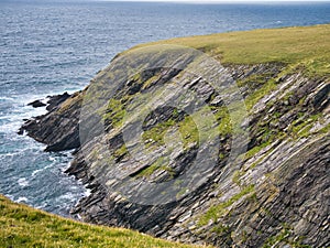 Eroded strata in sea cliffs on the west coast of St Ninian`s Isle on the west coast of the south of Mainland Shetland, UK.