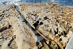 Eroded and Weathered rocks on a beach