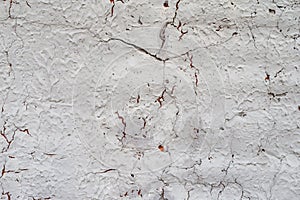 Eroding exterior stucco plastered wall