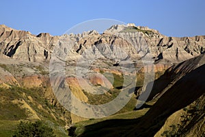 Eroding peaks and yellow mounds of the Badlands National Park So