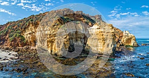 Eroding rocks on ocean coastline.