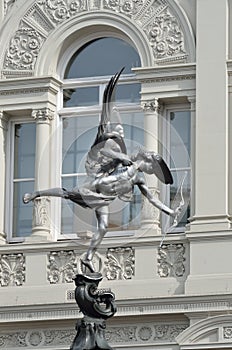 Eros statue with arch photo