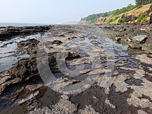 Erosion by sea waves on the rock at Kashid Beach