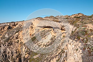 Erosional effects on a cliff on the Atlantic coast near Vila Nova de Milfontes, Odemira, Portugal. In the footsteps of Rota