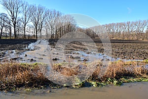 Erosive water stream on field photo