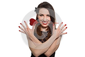 Erotic looking woman with red lipstick holding Valentine heart i