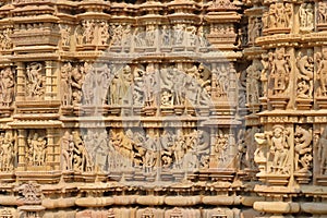 Erotic statues on the walls outside the temple of khajuraho